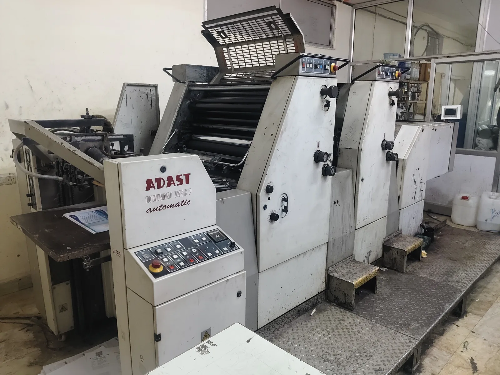 2-color multi-color offset printing machine operating on production floor